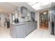 Updated kitchen with granite countertops, stainless appliances, and an abundance of storage at 2285 Hidden Meadows E Dr, Palm Harbor, FL 34683