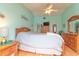 Spacious main bedroom with light wood furniture, vaulted ceiling, ceiling fan, and relaxing ambiance at 2285 Hidden Meadows E Dr, Palm Harbor, FL 34683