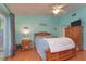 Bright bedroom offers natural light, a ceiling fan, and comfortable furnishings, creating a cozy retreat at 2285 Hidden Meadows E Dr, Palm Harbor, FL 34683