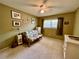 Bedroom with neutral carpet, green walls, and a floral futon at 2457 Ecuadorian Way # 27, Clearwater, FL 33763