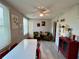 Dining room with laminate floors, decorative shelving, and bright natural light at 2457 Ecuadorian Way # 27, Clearwater, FL 33763