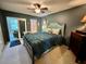 Stylish main bedroom features a ceiling fan and an ensuite bathroom at 2457 Ecuadorian Way # 27, Clearwater, FL 33763