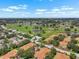 Wide aerial view of a Primary planned community with multiple ponds and golf course features at 2516 New Haven Cir, Sun City Center, FL 33573