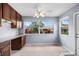 Cozy dining area featuring a built-in desk, plenty of light, and views of the landscaped community at 2516 New Haven Cir, Sun City Center, FL 33573
