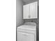 Bright laundry area with upper cabinets, offering both storage and functionality at 2516 New Haven Cir, Sun City Center, FL 33573