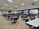 Large recreation room with tables and chairs, ideal for social gatherings and community events at 2516 New Haven Cir, Sun City Center, FL 33573