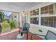 Enjoy the back porch of this home with chairs, brick floors, and lots of greenery at 2710 10Th N St, St Petersburg, FL 33702
