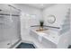 The bright bathroom features a luxurious soaking tub and separate glass shower at 2710 10Th N St, St Petersburg, FL 33702