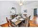 Formal dining room boasts hardwood floors, elegant chandelier, and decorative arches to other rooms at 2710 10Th N St, St Petersburg, FL 33702