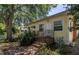 Exterior of a home with brick stairs leading to the front door, surrounded by lush landscaping at 2710 10Th N St, St Petersburg, FL 33702