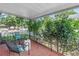 The cozy front porch with brick floors offers a relaxing spot to unwind at 2710 10Th N St, St Petersburg, FL 33702