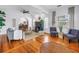 Spacious living room with hardwood floors, a fireplace, and comfortable seating at 2710 10Th N St, St Petersburg, FL 33702