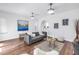 Relaxing living room with art on the wall, hardwood flooring and an archway to the dining area at 2710 10Th N St, St Petersburg, FL 33702