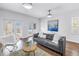 Bright and stylish living room features hardwood floors, modern furniture, and a view to the outdoor space at 2710 10Th N St, St Petersburg, FL 33702