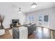 Living room with hardwood floors, modern decor, and double doors leading to the outdoor space at 2710 10Th N St, St Petersburg, FL 33702