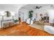 Inviting living room featuring hardwood floors, a comfortable seating area, and arched doorways at 2710 10Th N St, St Petersburg, FL 33702