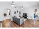 Open living area with hardwood flooring, modern furnishings, and an archway leading to the kitchen at 2710 10Th N St, St Petersburg, FL 33702