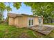 A view of the back of the home, showing the deck and backyard at 3559 Rock Royal Dr, Holiday, FL 34691