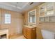 Bathroom with tan tile and an outdated vanity at 3559 Rock Royal Dr, Holiday, FL 34691