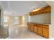 Spacious dining area showcases tile flooring, built-in cabinetry, and a doorway to the entry at 3559 Rock Royal Dr, Holiday, FL 34691