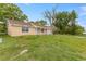 Quaint single-story home with a well-maintained lawn and ample outdoor space at 3559 Rock Royal Dr, Holiday, FL 34691
