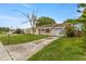 Lovely single-story home featuring an attached garage and spacious driveway, ready for personalization at 3559 Rock Royal Dr, Holiday, FL 34691