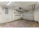 Empty garage featuring overhead door and shelving at 3559 Rock Royal Dr, Holiday, FL 34691