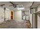A garage view featuring a water heater, a utility sink and washer and dryer hookups at 3559 Rock Royal Dr, Holiday, FL 34691