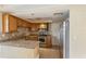 Cozy kitchen with granite countertops, stainless steel appliances, and ample cabinet space at 3559 Rock Royal Dr, Holiday, FL 34691