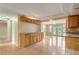 Bright kitchen features tile floors, granite counters, and an open layout leading to the living area with outdoor access at 3559 Rock Royal Dr, Holiday, FL 34691