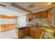 Functional kitchen with granite countertops and stainless steel dishwasher for a convenient culinary experience at 3559 Rock Royal Dr, Holiday, FL 34691