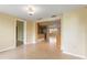 Inviting living room with neutral walls and tile flooring, open to kitchen and other rooms at 3559 Rock Royal Dr, Holiday, FL 34691