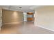 Spacious living room with tile floors leading to the kitchen area, perfect for entertaining at 3559 Rock Royal Dr, Holiday, FL 34691