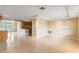 Bright open-concept living room, seamless transition into kitchen, and ample space for relaxation at 3559 Rock Royal Dr, Holiday, FL 34691