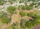 Expansive aerial view of a large lot with mature trees in a residential neighborhood at 3642 Fantasy Way, Brooksville, FL 34604