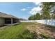 Expansive backyard featuring lush greenery, a privacy fence, and shaded areas from mature trees at 3642 Fantasy Way, Brooksville, FL 34604