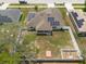 Aerial view of home featuring fenced backyard and solar panels at 3642 Fantasy Way, Brooksville, FL 34604