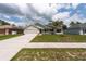 Beautiful home featuring solar panels, a two-car garage, and a well-kept front lawn at 3642 Fantasy Way, Brooksville, FL 34604