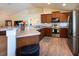 Well-equipped kitchen with granite counters, stainless steel appliances, and wood cabinets at 3642 Fantasy Way, Brooksville, FL 34604