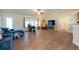 Spacious living room with high ceilings, wood floors and ample natural light at 3642 Fantasy Way, Brooksville, FL 34604