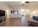 Open floor plan with living room flowing into kitchen with wood floors and high ceilings at 3642 Fantasy Way, Brooksville, FL 34604