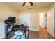Open office space with wood floors, a workspace, and an opening to another room at 3642 Fantasy Way, Brooksville, FL 34604