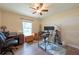 Comfortable office space with a ceiling fan, a window view, and two desks at 3642 Fantasy Way, Brooksville, FL 34604