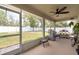 Screened-in patio with outdoor furniture, a grill, and views of the backyard at 3642 Fantasy Way, Brooksville, FL 34604