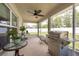 A beautiful patio with outdoor furniture, a grill, and views of the fenced backyard at 3642 Fantasy Way, Brooksville, FL 34604