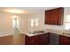 Bright kitchen with stainless steel appliances, modern countertops, and tile flooring, offering a sleek design at 38535 Clinton Ave, Dade City, FL 33525