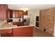 Functional kitchen with ample cabinet space, stainless steel refrigerator, and breakfast bar at 38535 Clinton Ave, Dade City, FL 33525
