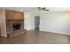 Inviting living room featuring a brick fireplace, tiled floors, and neutral paint at 38535 Clinton Ave, Dade City, FL 33525