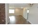 Living room featuring tiled floors and an open layout, leading to the front door and other rooms at 38535 Clinton Ave, Dade City, FL 33525