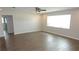 Spacious living room with tiled floors, a ceiling fan, and bright natural light at 38535 Clinton Ave, Dade City, FL 33525